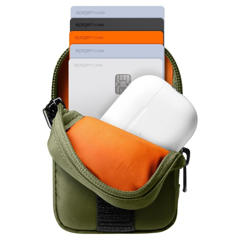 An olive green card holder pouch with an orange interior, shown open with four Spigen cards and a white wireless earbud case inside, on a white background.
