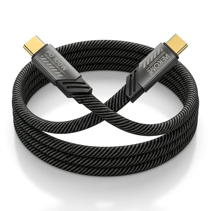 A coiled black braided HDMI cable with gold-toned USB-C connectors, featuring visible branding on the connector housings, set against a clean white background.