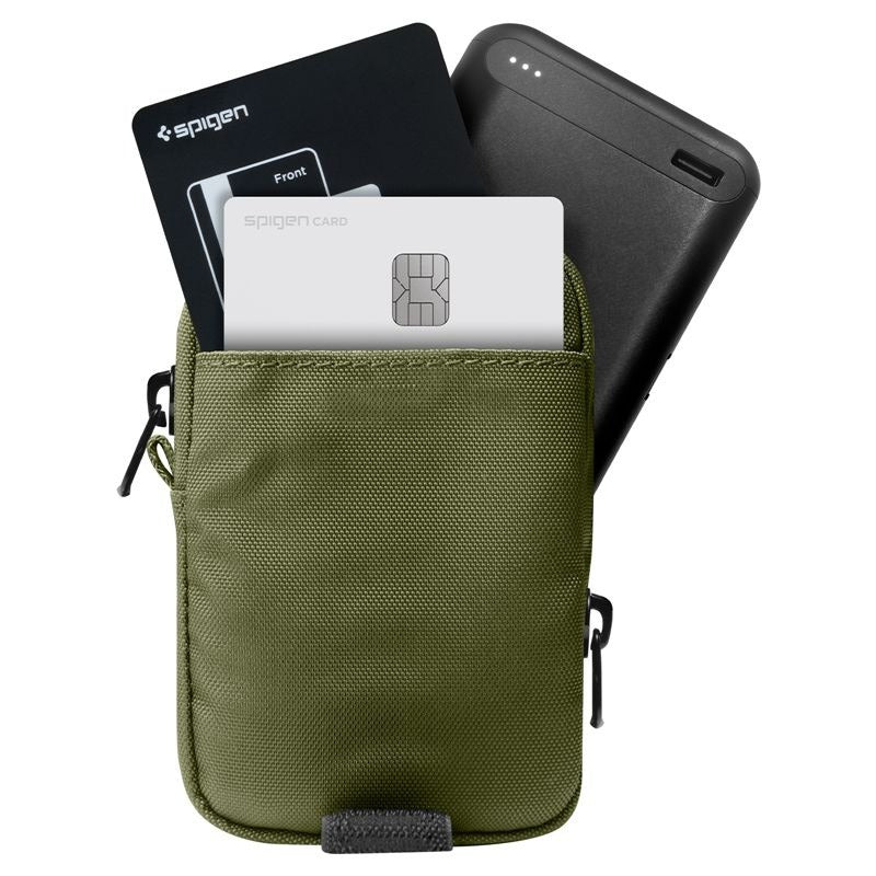 An olive green Spigen card holder pouch shown on a white background, filled with cards and a black power bank to demonstrate its capacity.