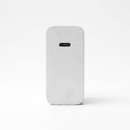 A light gray marble-textured phone case with a rounded rectangular shape and a horizontal cutout near the top, shown on a clean white background.