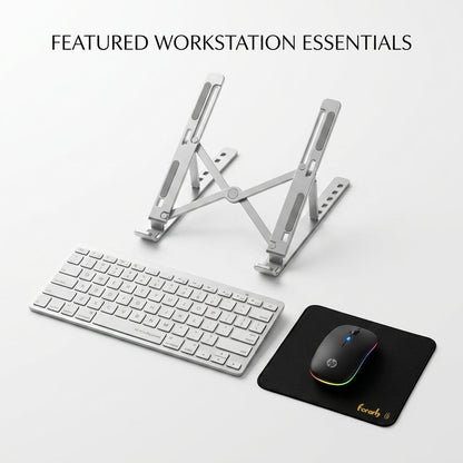 A silver aluminum keyboard stand shown with a white wireless keyboard, a black mouse on a black mousepad, and the text 'FEATURED WORKSTATION ESSENTIALS' at the top on a light gray background.